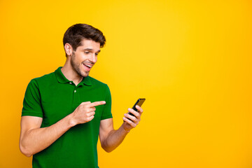 Portrait of his he nice attractive cheerful cheery glad guy wearing violet shirt holding in hands...