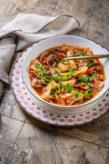 Healthy cabbage soup with meatballs, mushrooms and green onions, sauerkraut soup