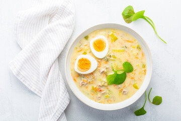 Homemade Easter soup with hard boiled egg and vegetables