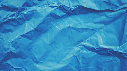 Obraz premium Vibrant blue crumpled paper texture with light lines for creative design