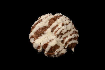 Profiteroles with coconut cream on a black background.