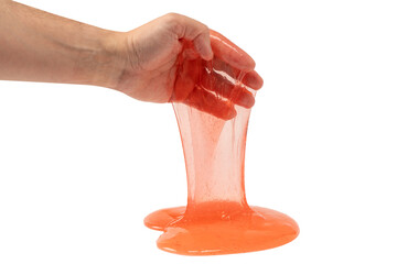 Red slime toy in man hand isolated on white.