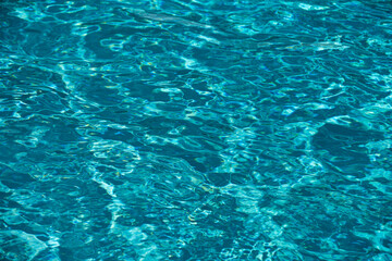 Blue ripped water in swimming pool, water pool texture and surface water backgraund.