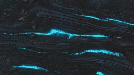 Mysterious wooden surface with glowing blue veins for nature and art design
