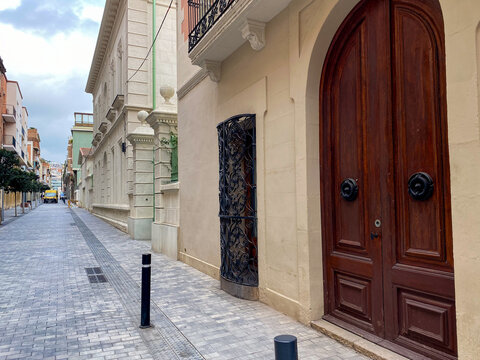 Narrow European street scene with colorful buildings, travel exploration, architecture, urban tranquility
