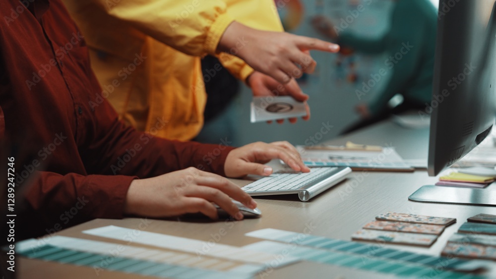 Poster a dynamic office scene showing hands on a keyboard while a team member points at ideas, highlighting