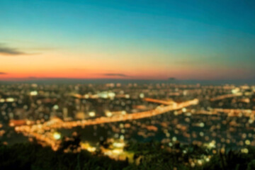 The lights of the night city. Blurred background. Lanterns on the street. big city lights in the twilight evening with blurring. Colorful circles of light abstract. circular bokeh on blue horizon.