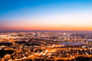 The lights of the night city. Blurred background. Lanterns on the street. big city lights in the twilight evening with blurring. Colorful circles of light abstract. circular bokeh on blue horizon.