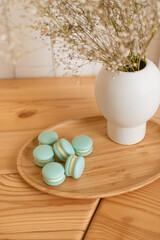 Blue handmade macarons in light kitchen