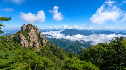 Fototapeta premium Scenic Mountain View with Clouds and Green Forest under Blue Sky