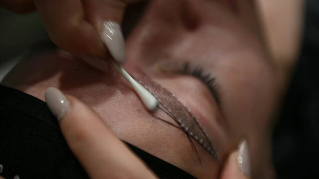 Precise eyebrow microblading procedure with measuring lines for perfect symmetry and shaping