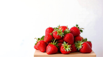 Fresh Ripe Strawberries on Wooden Block with White Background