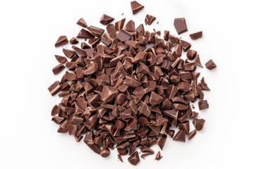 A pile of rich dark chocolate pieces scattered on a white background, ideal for culinary and dessert themes.