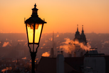 The lamp is lit during sunrise. © Jan