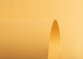 Gold and yellow paper with smooth, curved texture and shimmering metallic finish. Elegant, refined...