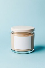 Minimalistic jar with smooth beige contents against soft blue ba