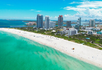 Naklejka premium Top view of South Miami Beach. Scenic drone view of Miamis famous coastline. Miami Beach skyline with skyscrapers. Aerial view of Miami Beach in summer. Miami Beach shore with skyscrapers.