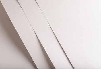 Pearl, off-white, and beige paper with metallic shimmer and smooth texture. Layered, folded design with diagonal lines creates an elegant, minimal abstract composition. Refined, soft finish with a