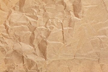 Crumpled packaging brown paper textured background. Vintage brown paper.