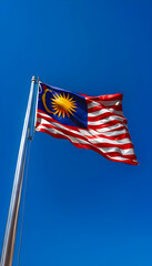 Obraz premium Bold and Vibrant: Malaysian Flag Soars High with National Pride and Cultural Significance