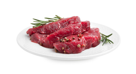 Pieces of raw beef meat and spices isolated on white