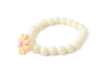 One beige hair tie with flower isolated on white