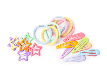 Colorful cute hair accessories isolated on white, top view