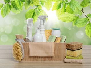 Eco-friendly cleaning products on wooden table outdoors