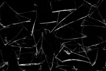 Broken glass fragments on black background.