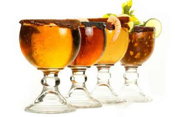 Beer mix with several ingredients, acid stuff on the edges, shrimp, lemon, and avocado