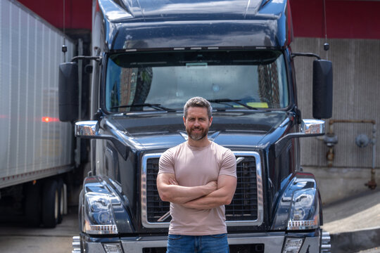 Truck driver. CDL. Men driver near lorry truck. Man owner truck driver. Millennial trucker. Trucking owner. Transportation industry vehicles. Handsome man posing in front of truck.