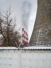 Smoking pipes of a gas thermal power plant in winter