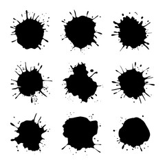 A collection of black ink splashes arranged in a grid-like structure with rough textures.