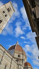 "Florence, Italy – A breathtaking view of the city’s iconic landmarks, including the Duomo and Ponte Vecchio. 