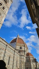 "Florence, Italy – A breathtaking view of the city’s iconic landmarks, including the Duomo and Ponte Vecchio. 