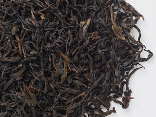 dried leaves of premium Taiwanese tea, macro photo on a white background