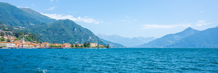 Visitors enjoy the serene beauty of Lake Como, surrounded by majestic mountains and charming villages. The clear blue waters reflect the vibrant landscape, evoking a sense of peace and relaxation.