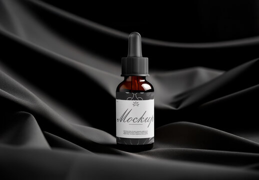 Amber Dropper Bottle Mockup on Elegant Black Fabric Background
