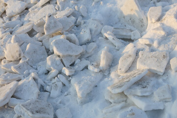 chipped pieces of compressed snow