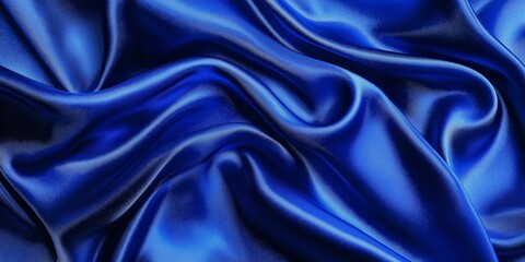 Obraz premium Elegant abstract background featuring classic royal blue satin texture with bright highlights and deep shadows for a dramatic effect