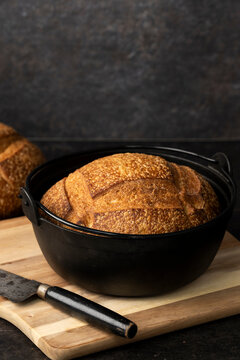 Loaf of sourdough bread in a cast iron dutch oven 