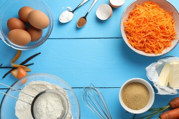 Frame of different ingredients for making carrot cake on light blue wooden table, flat lay