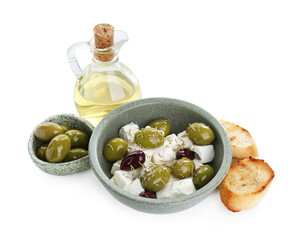 Marinated olives, feta cheese, bread pieces and oil isolated on white