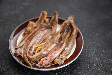 Anchovy fillet fish seafood snack aperitif fresh tasty food dish delicious gourmet food background on the table rustic food top view copy space pescetarian diet