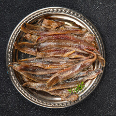 Anchovy fillet fish seafood snack aperitif fresh tasty food dish delicious gourmet food background...