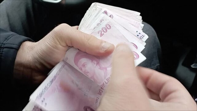 Man Counting Turkish Money Close up, Turkish lira banknotes, Tourist Exchgange Money in Bank of the Republic of Turkey.