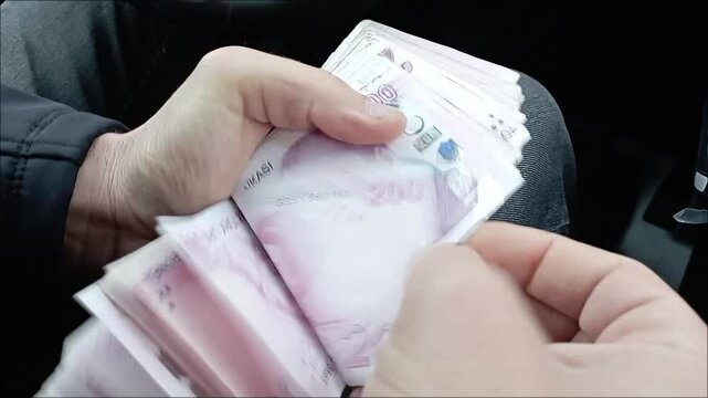 Man Counting Turkish Money Close up, Turkish lira banknotes, Tourist Exchgange Money in Bank of the Republic of Turkey.