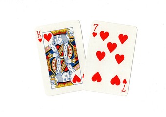 A king of hearts and one other card on a white background.