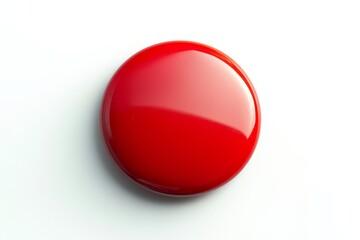 Bright Red Circular Button on White Background - A vivid red button with a glossy finish resting on a clean white surface, perfect for design and illustrative purposes