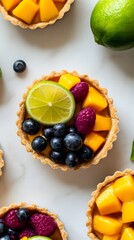 Mini tartlets filled with mango and jalapeno mousse, topped with a slice of lime.